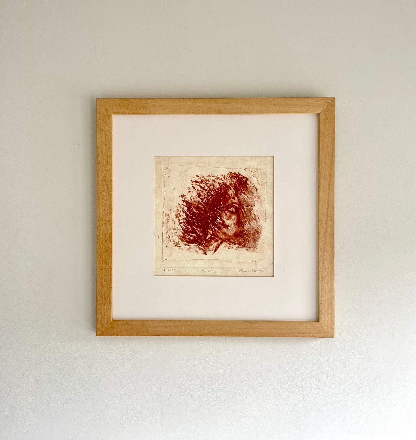 Etching in red ink of a woman’s profile by Sheila Oliner, 1995 artist proof, signed and framed