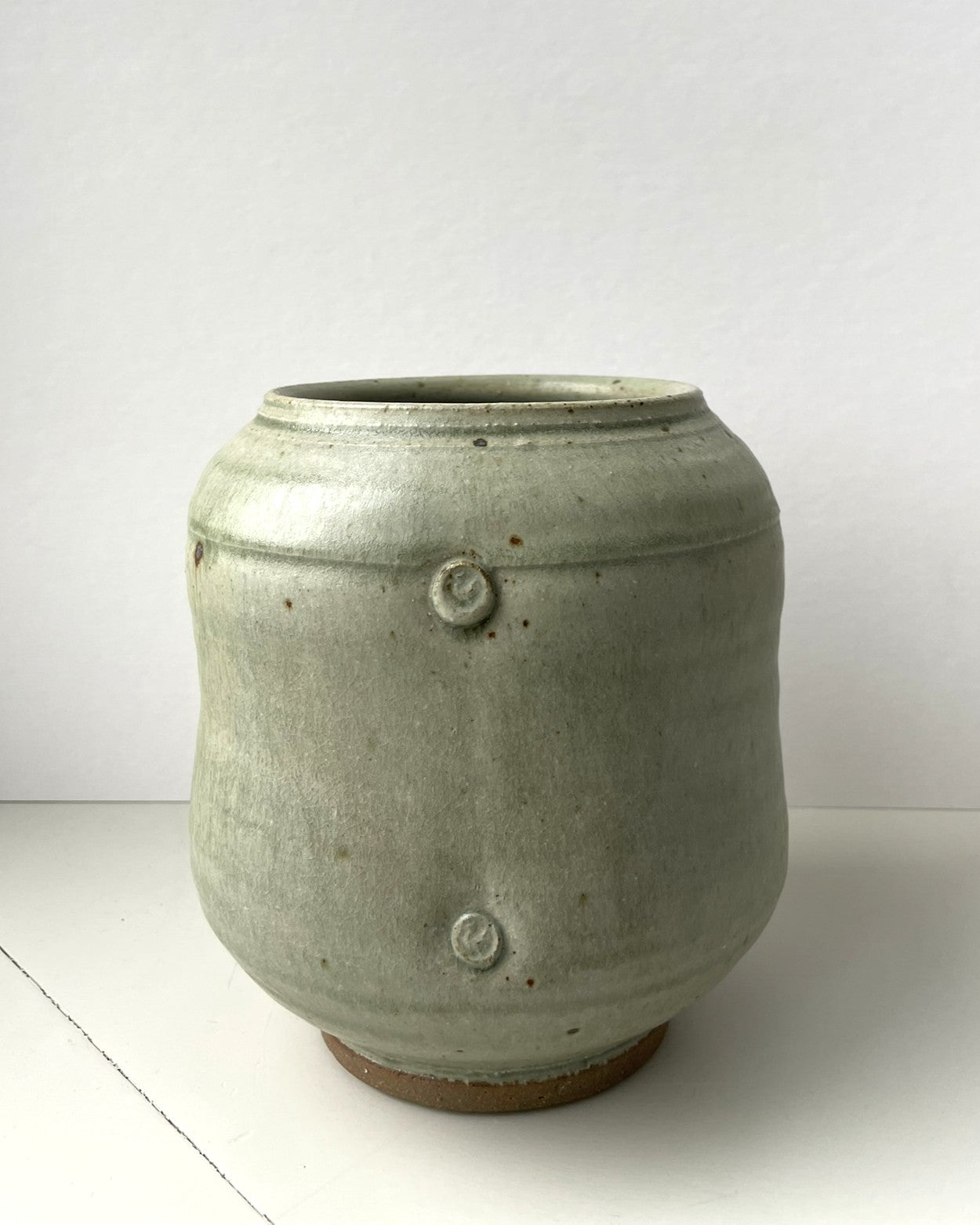 A green celadon glaze Jar by Arthur Griffiths
