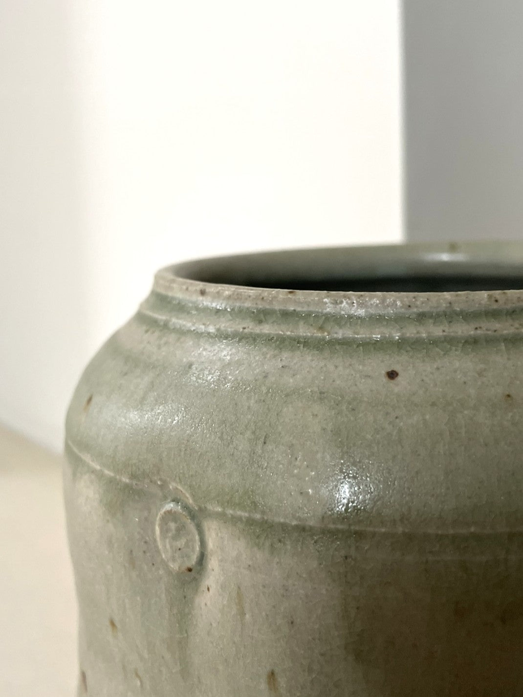 A green celadon glaze Jar by Arthur Griffiths